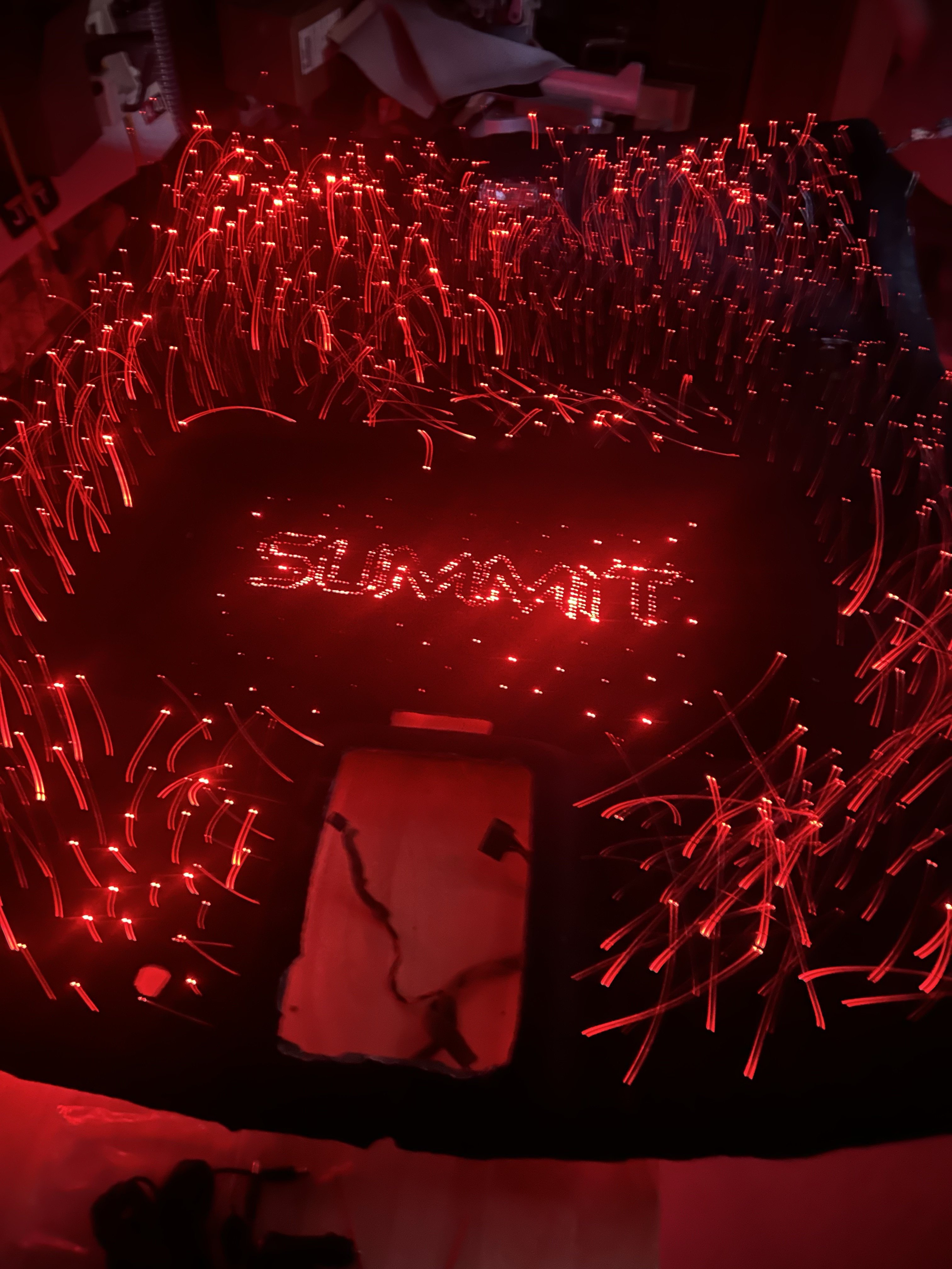 Fiber-optic starlight headliner glowing red with custom Summit logo